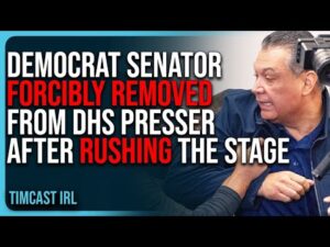 Democrat Senator FORCIBLY REMOVED From DHS Presser After RUSHING The Stage